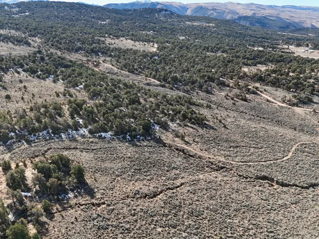 Aerial overview of property's location with a mountainous background