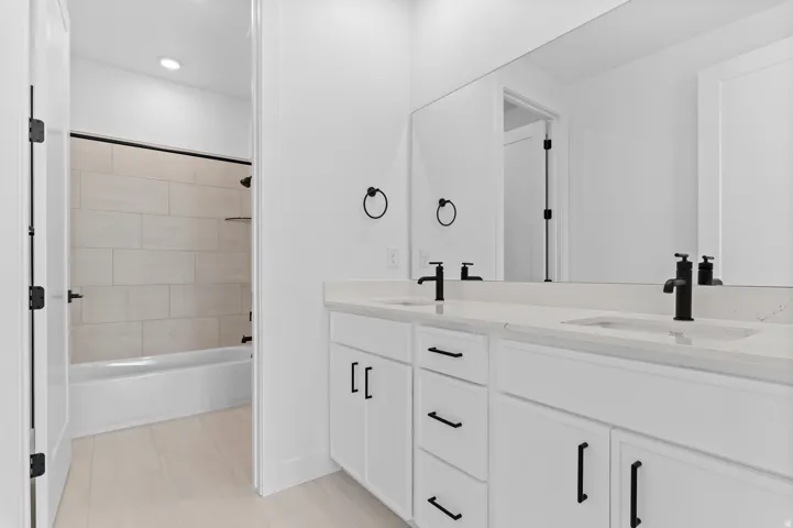 Dual vanity with undermount sinks and matte black fixtures