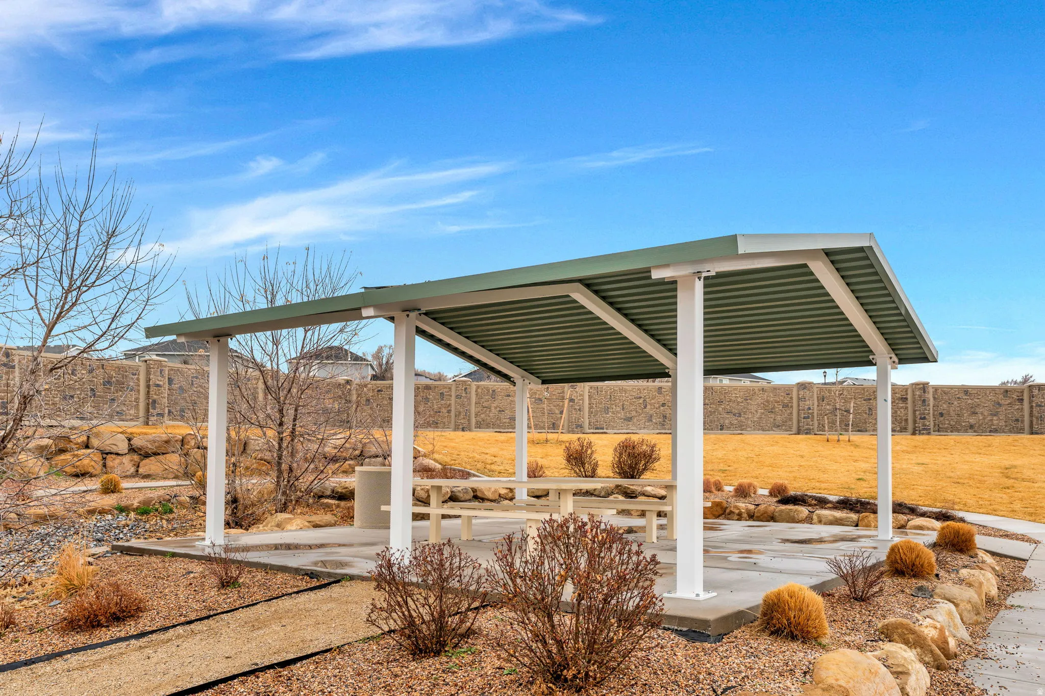Fenced backyard with a patio
