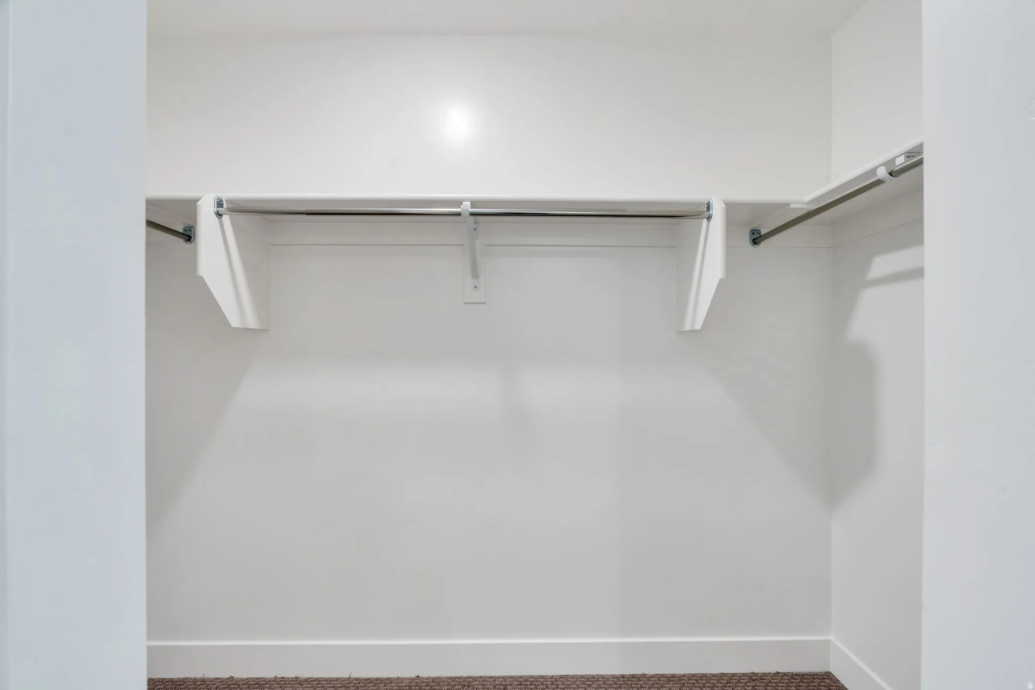 Walk in closet with carpet