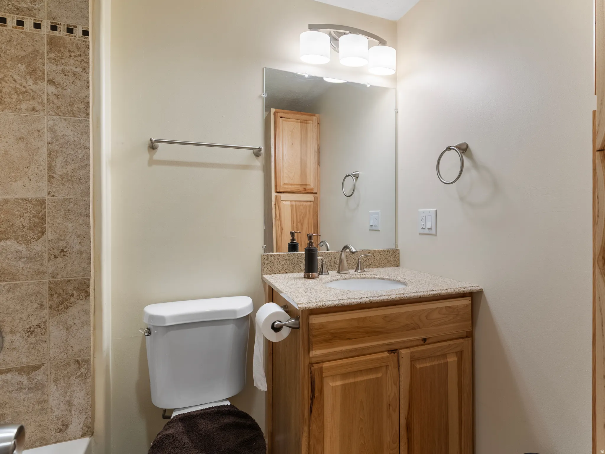 Full bath with vanity and toilet