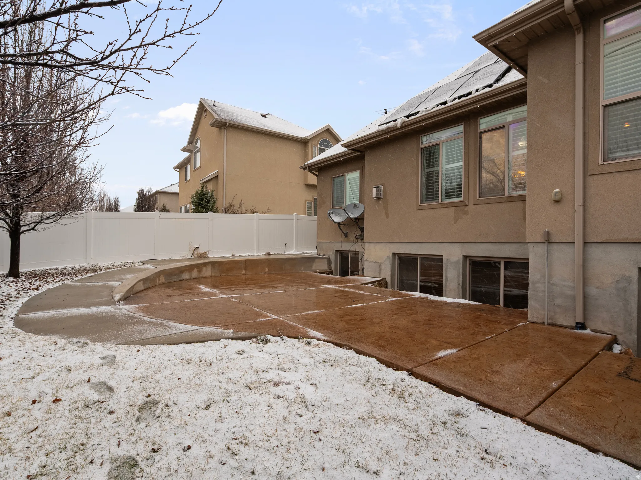 Back of house featuring stucco siding and a patio area
