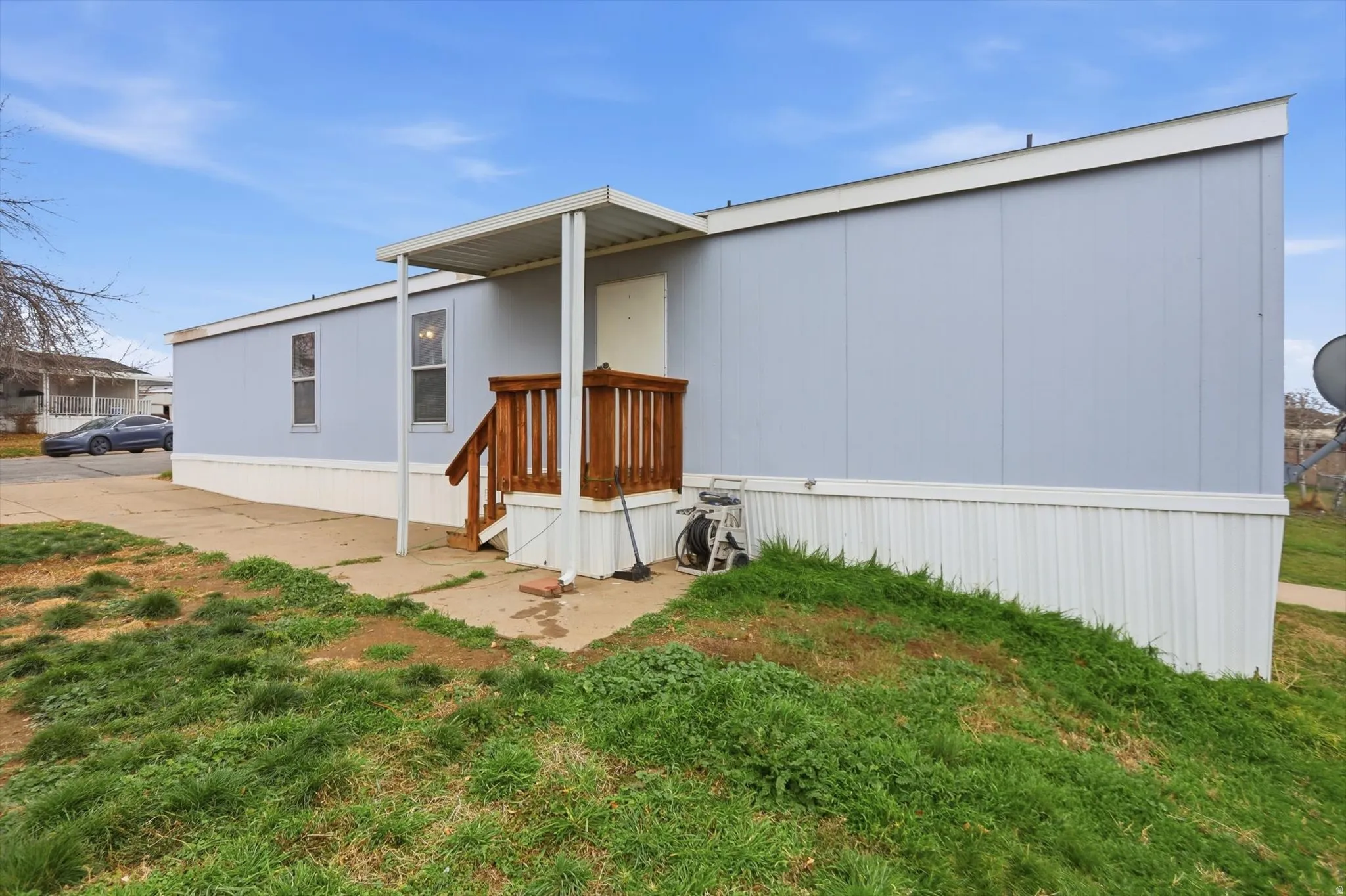 Rear view of property with a lawn