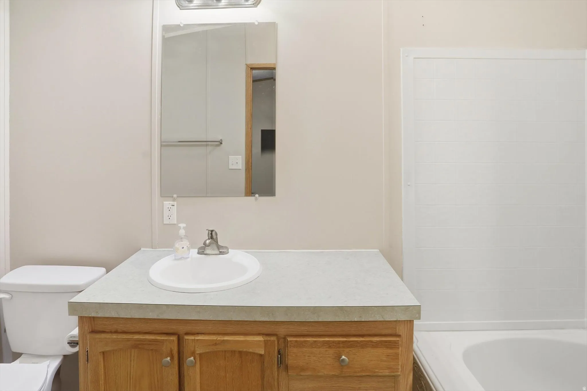 Full bath featuring vanity and tub / shower combination