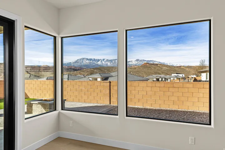 Unfurnished sunroom featuring a mountain view
