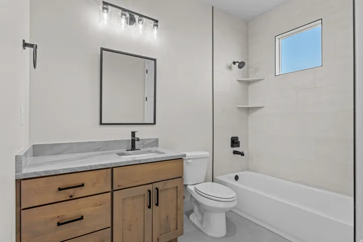 Full bathroom with vanity and  shower combination