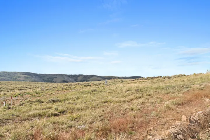 View of mountain backdrop with rural landscape