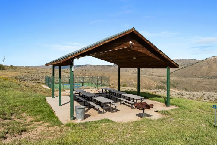 View of home's community with a patio and a mountain view