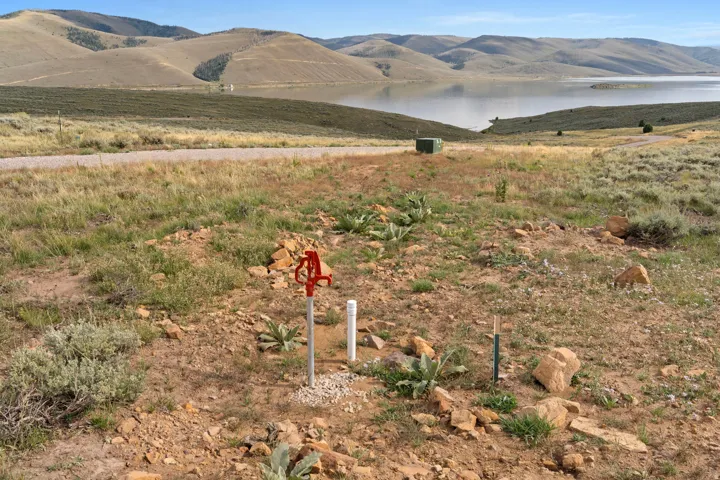 View of mountain backdrop featuring a nearby body of water