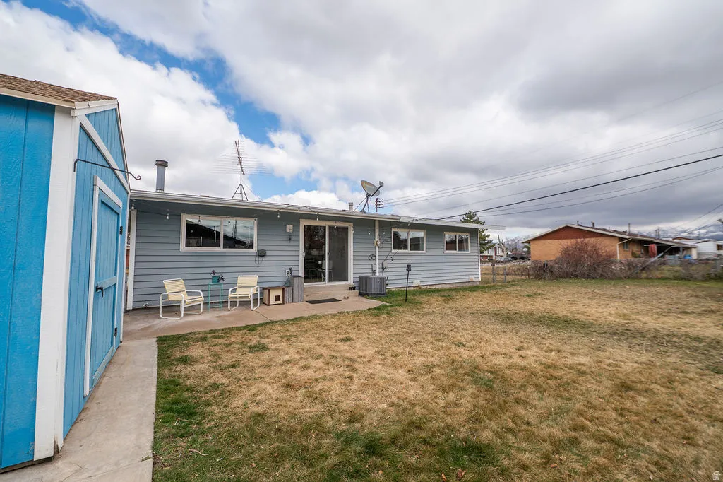 Rear view of house featuring a patio