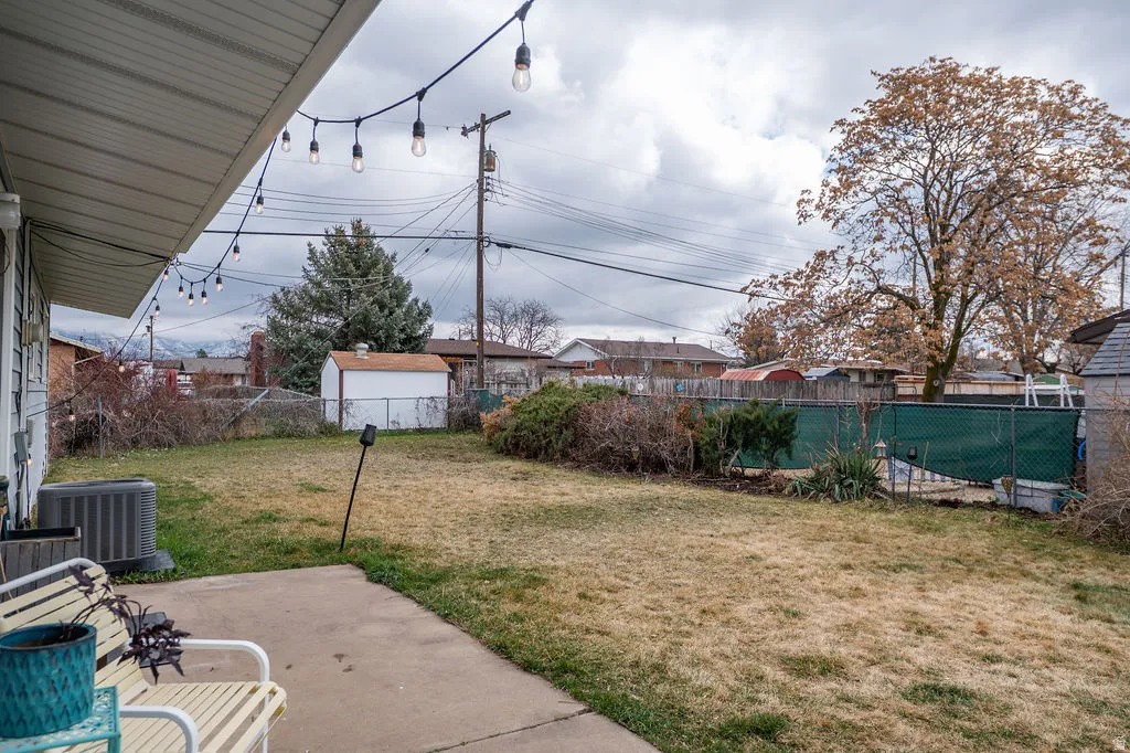 Fenced backyard with a patio area