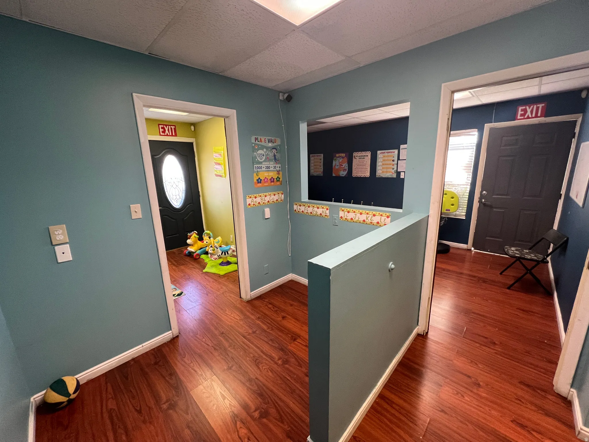 Entrance foyer featuring wood finished floors and a paneled ceiling