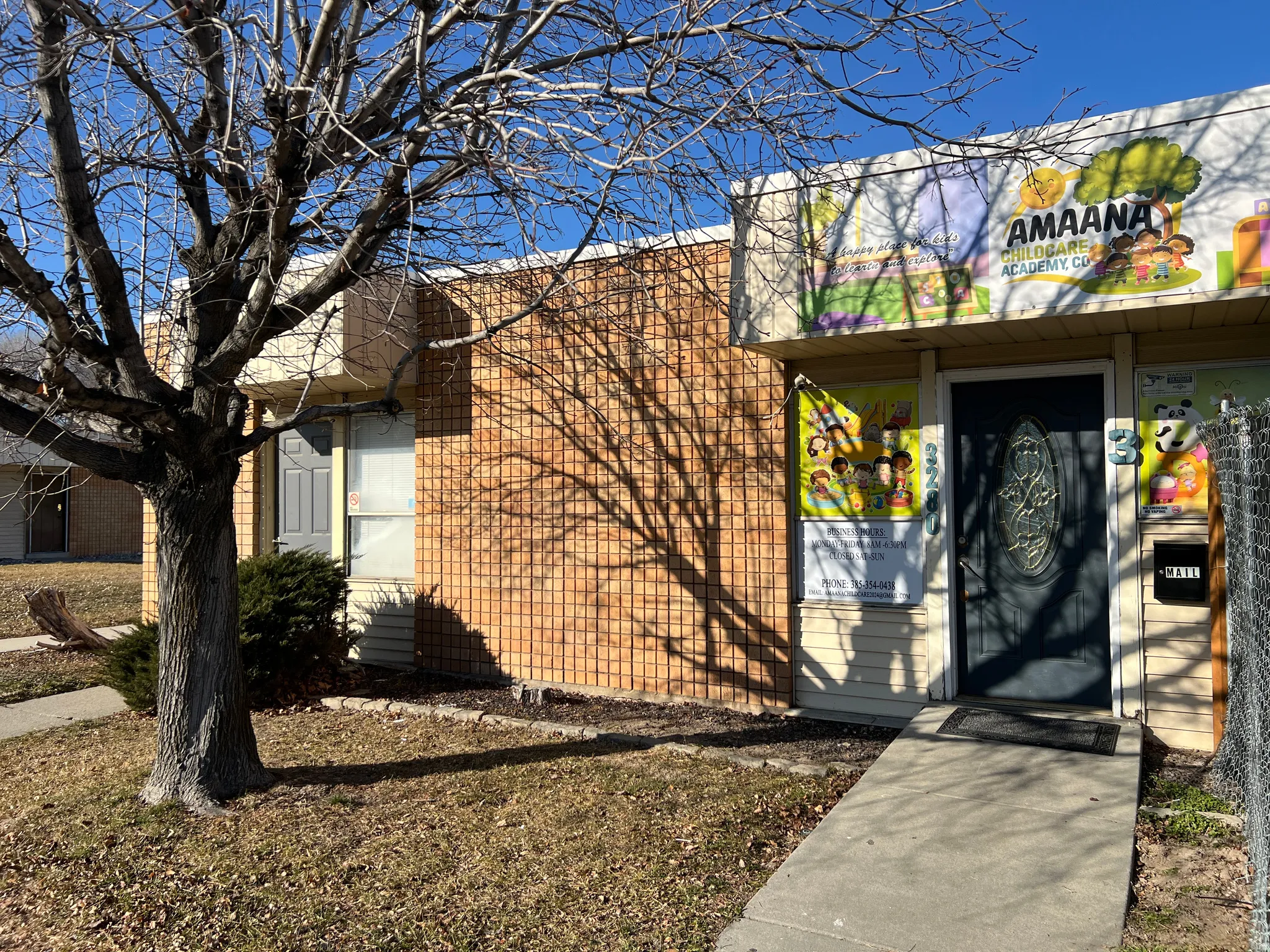 Entrance to property with brick siding