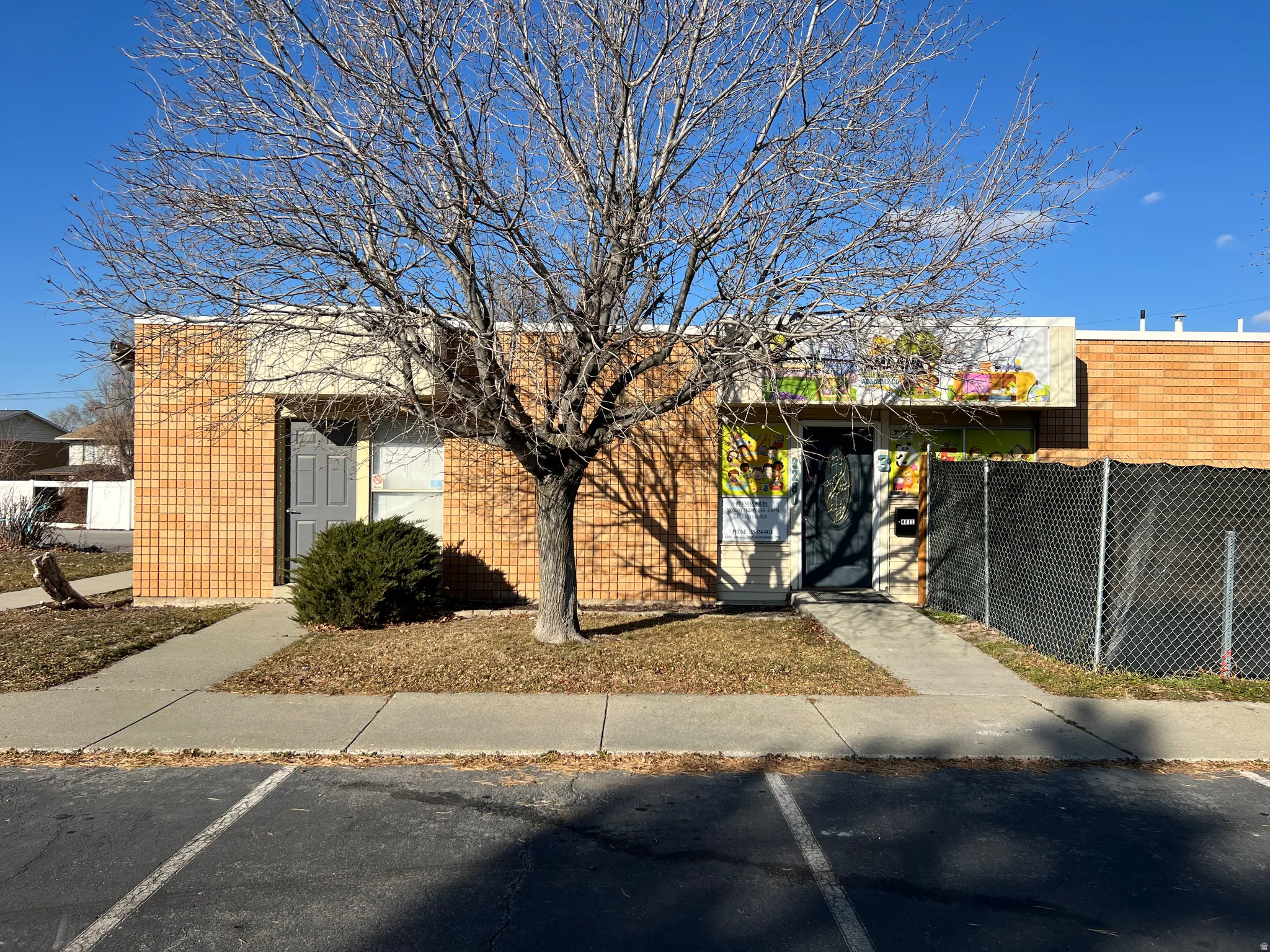 View of front of office with uncovered parking
