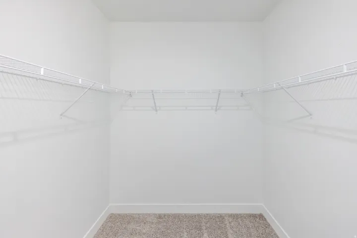 Wall-mounted wire shelving system with a corner configuration