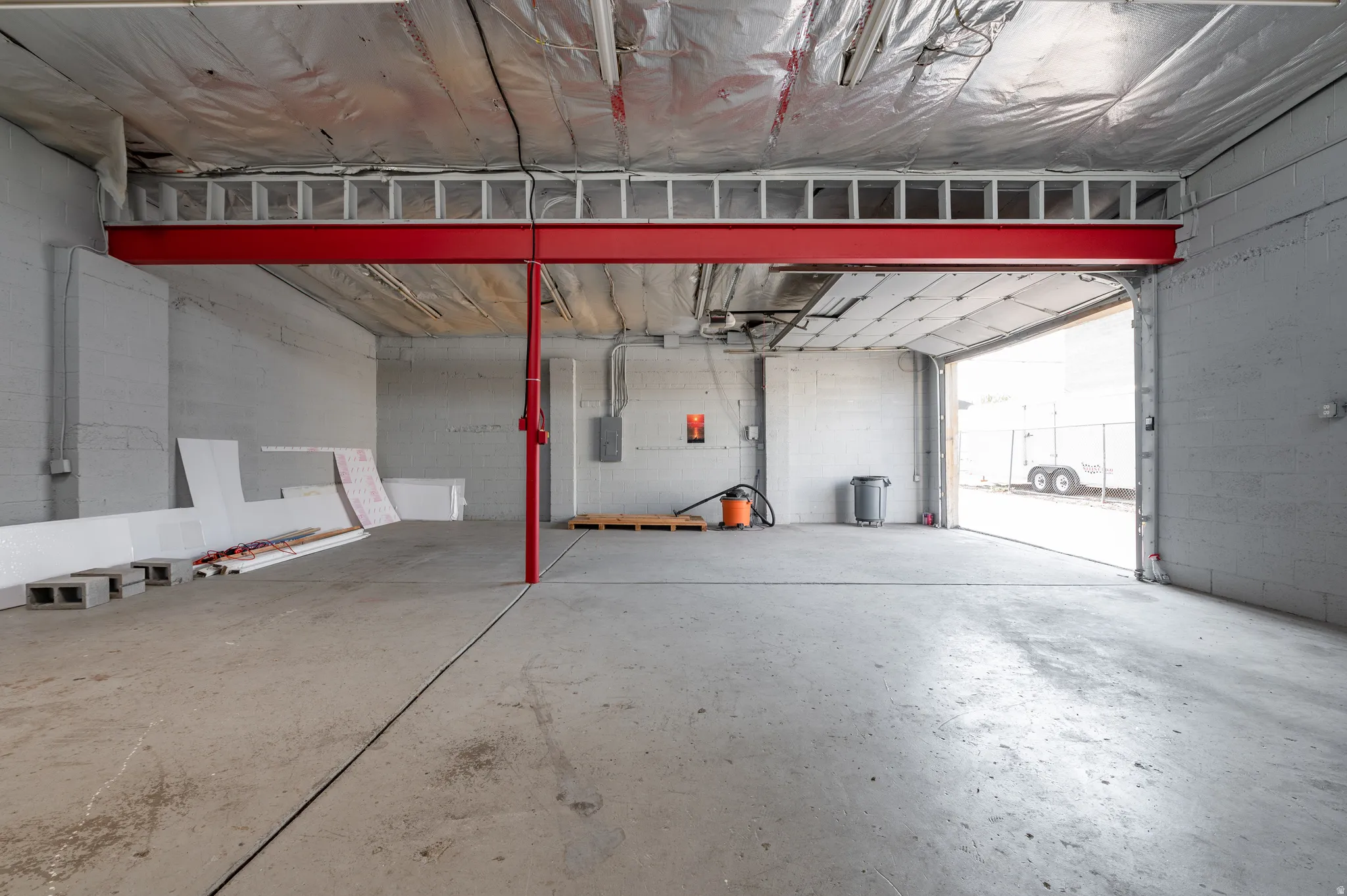 Garage with concrete block wall and electric panel