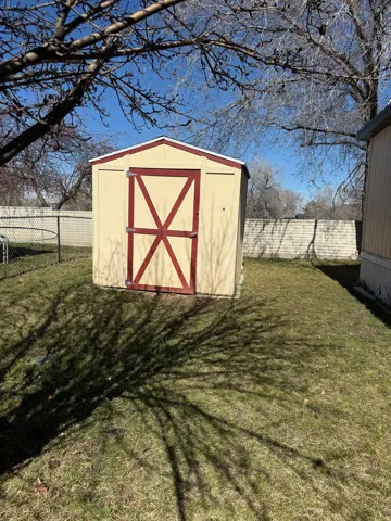 View of shed featuring a fenced backyard