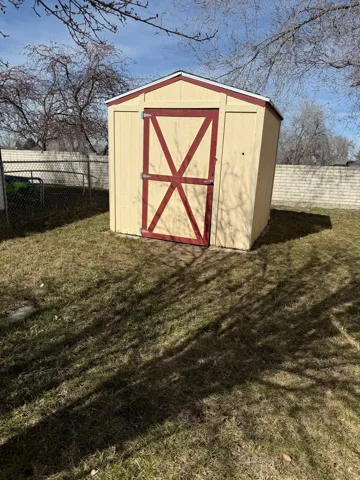 View of shed featuring a fenced backyard