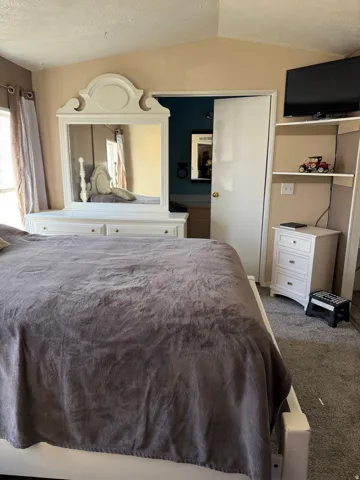 Bedroom featuring carpet flooring