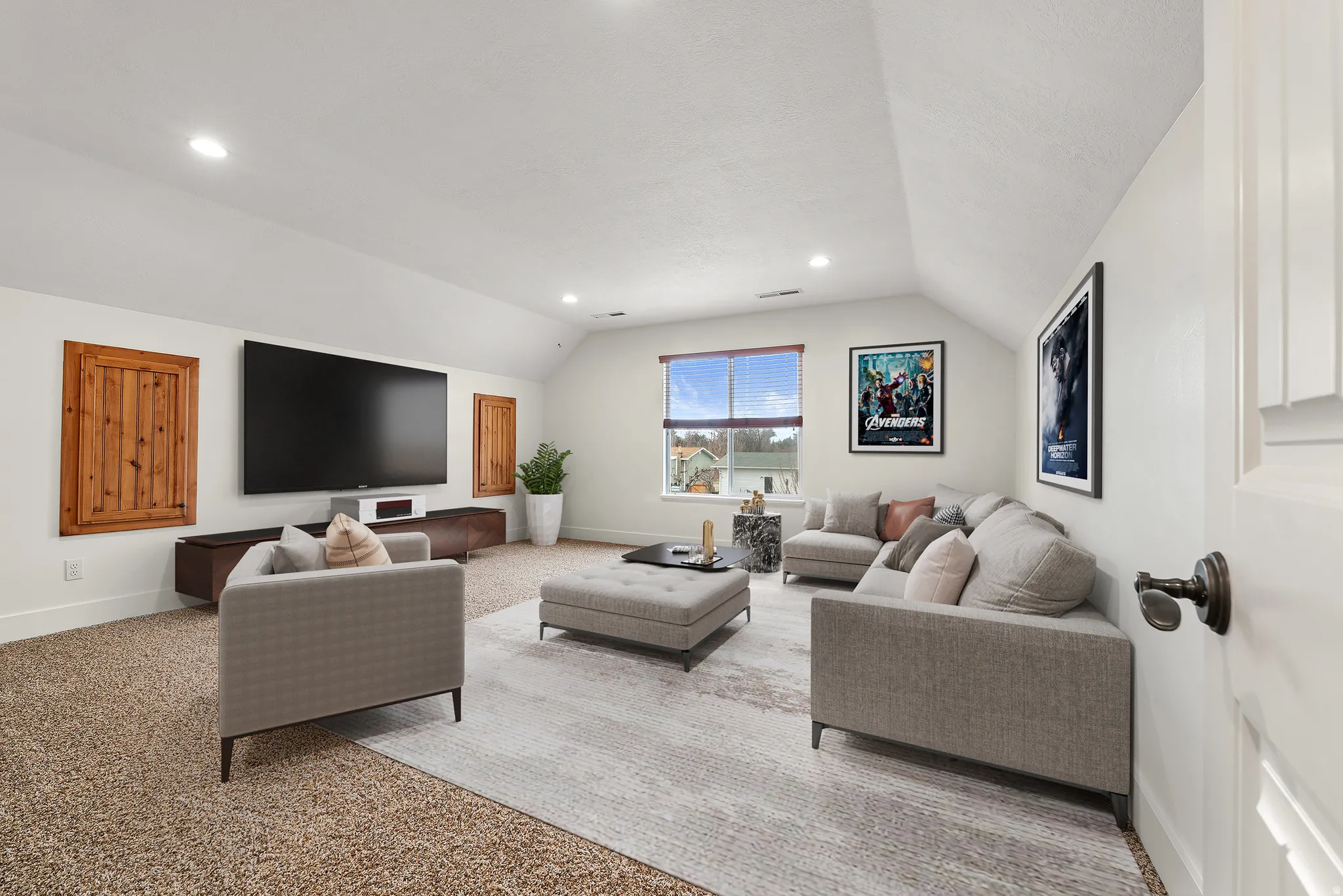 Living room with carpet floors and recessed lighting