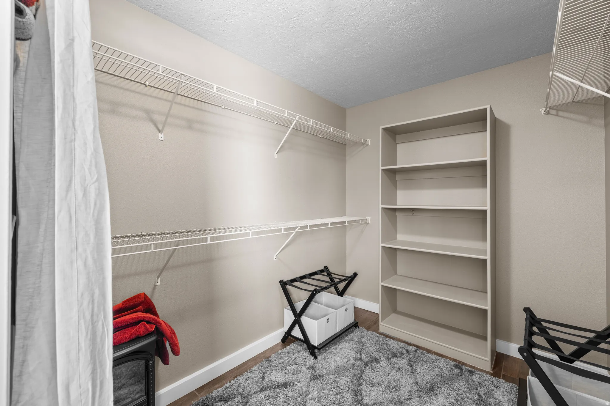 Walk in closet in primary bedroom
