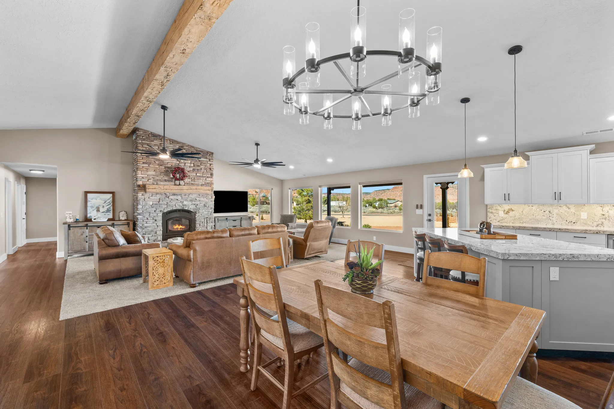Grand Room/Dining area with  vaulted ceiling with beam.