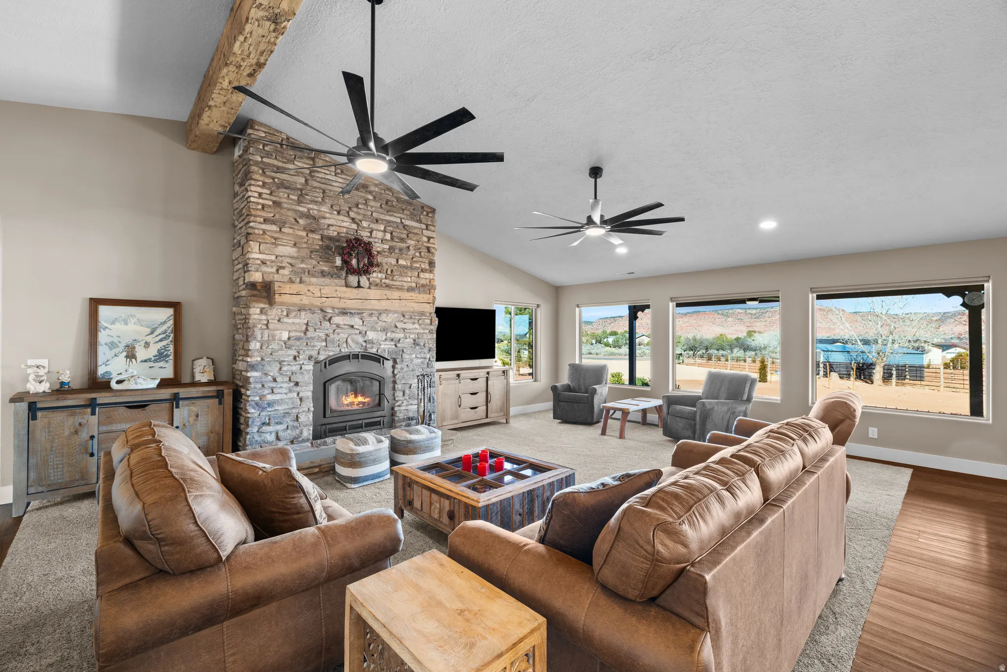 Grand Room/Living room featuring a custom rock fireplace
