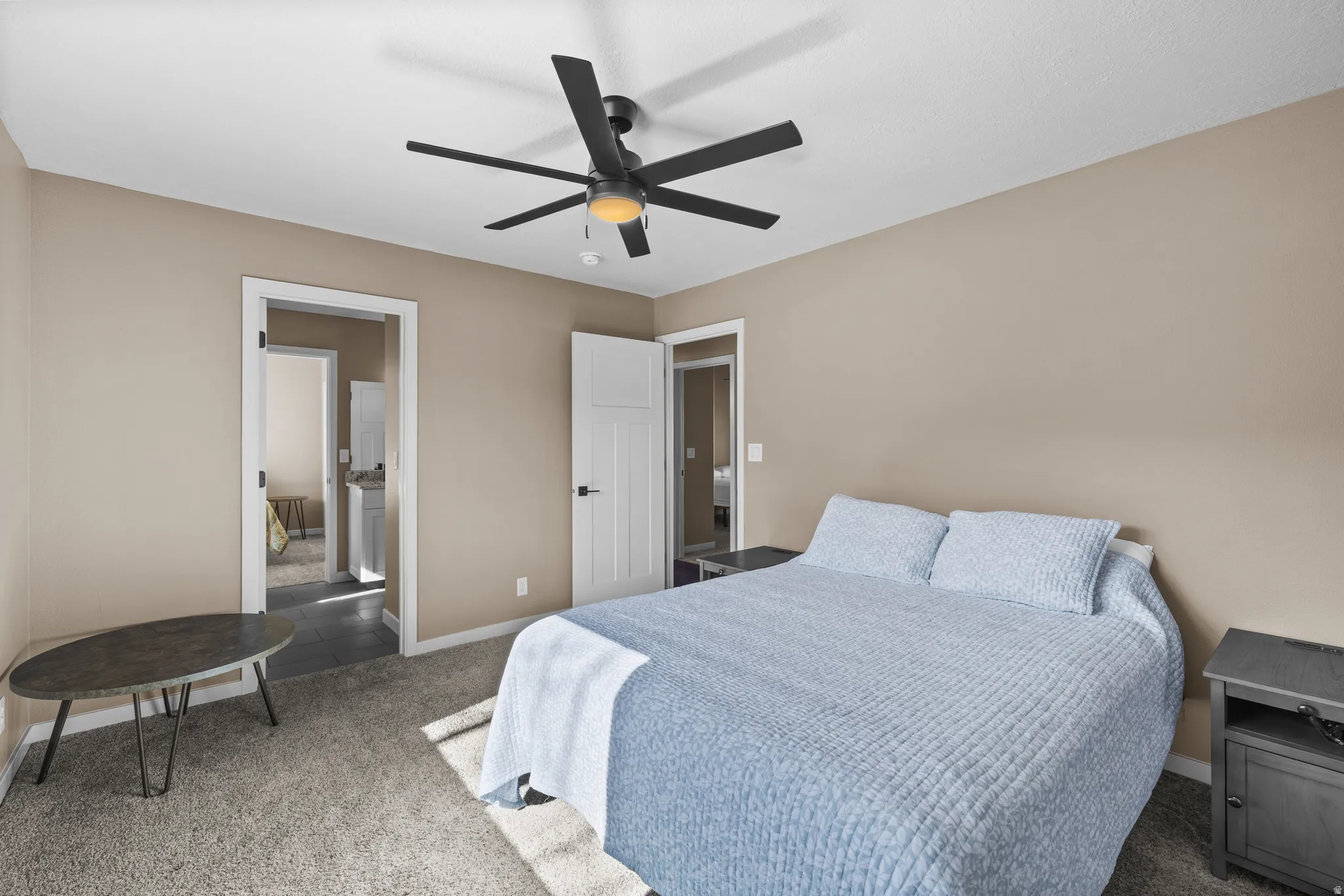 Bedroom featuring carpet floors and a ceiling fan