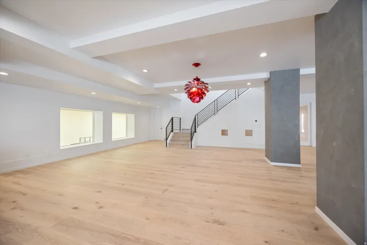 Unfurnished living room with recessed lighting and light wood finished floors