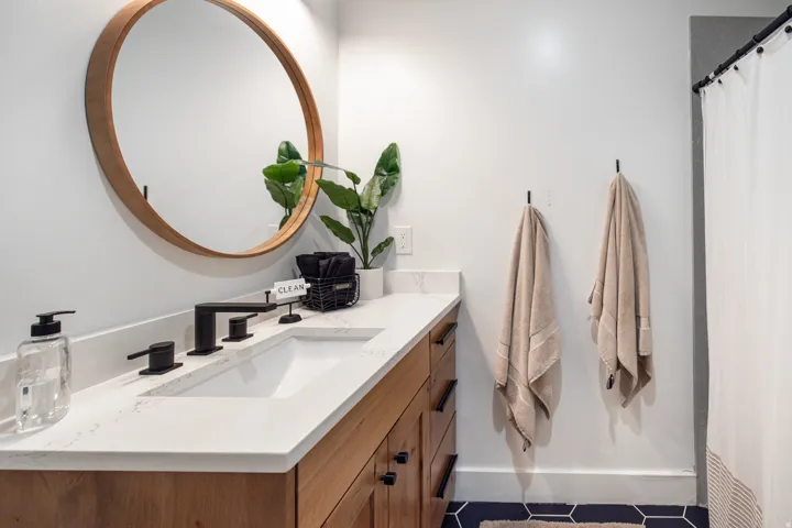 Full bathroom with vanity, a shower with curtain, and tile patterned floors