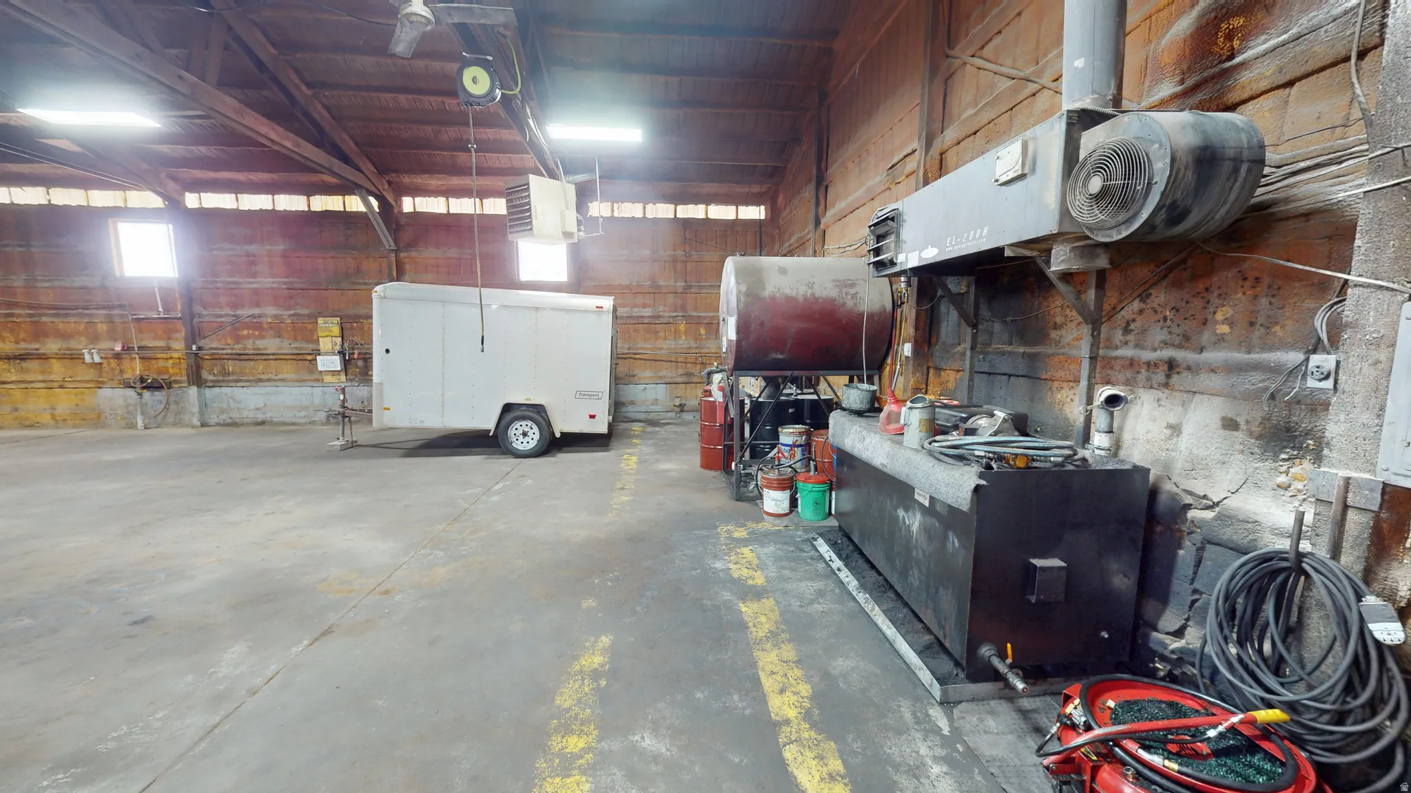 Garage featuring a heating unit