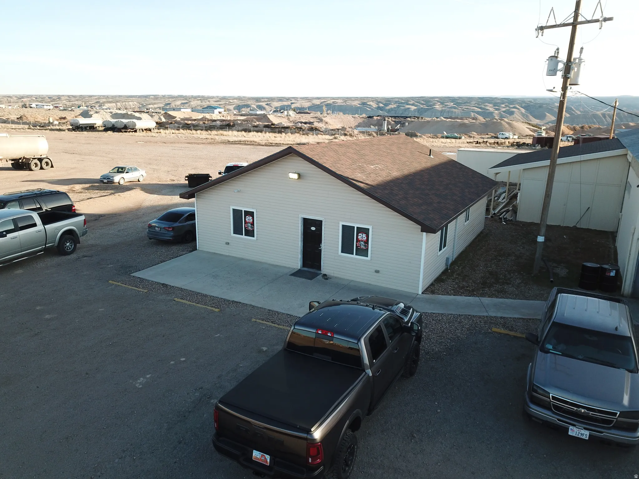 View of property with uncovered parking