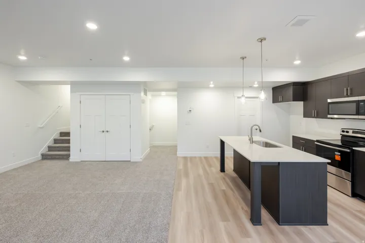 Kitchen island with a stainless-steel sink and chrome faucet