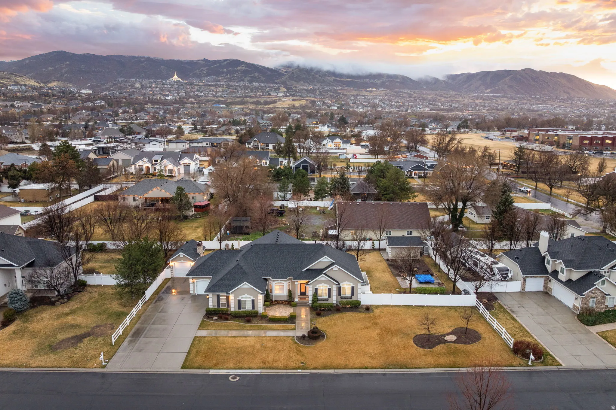 Aerial view of residential area featuring a mountain backdrop