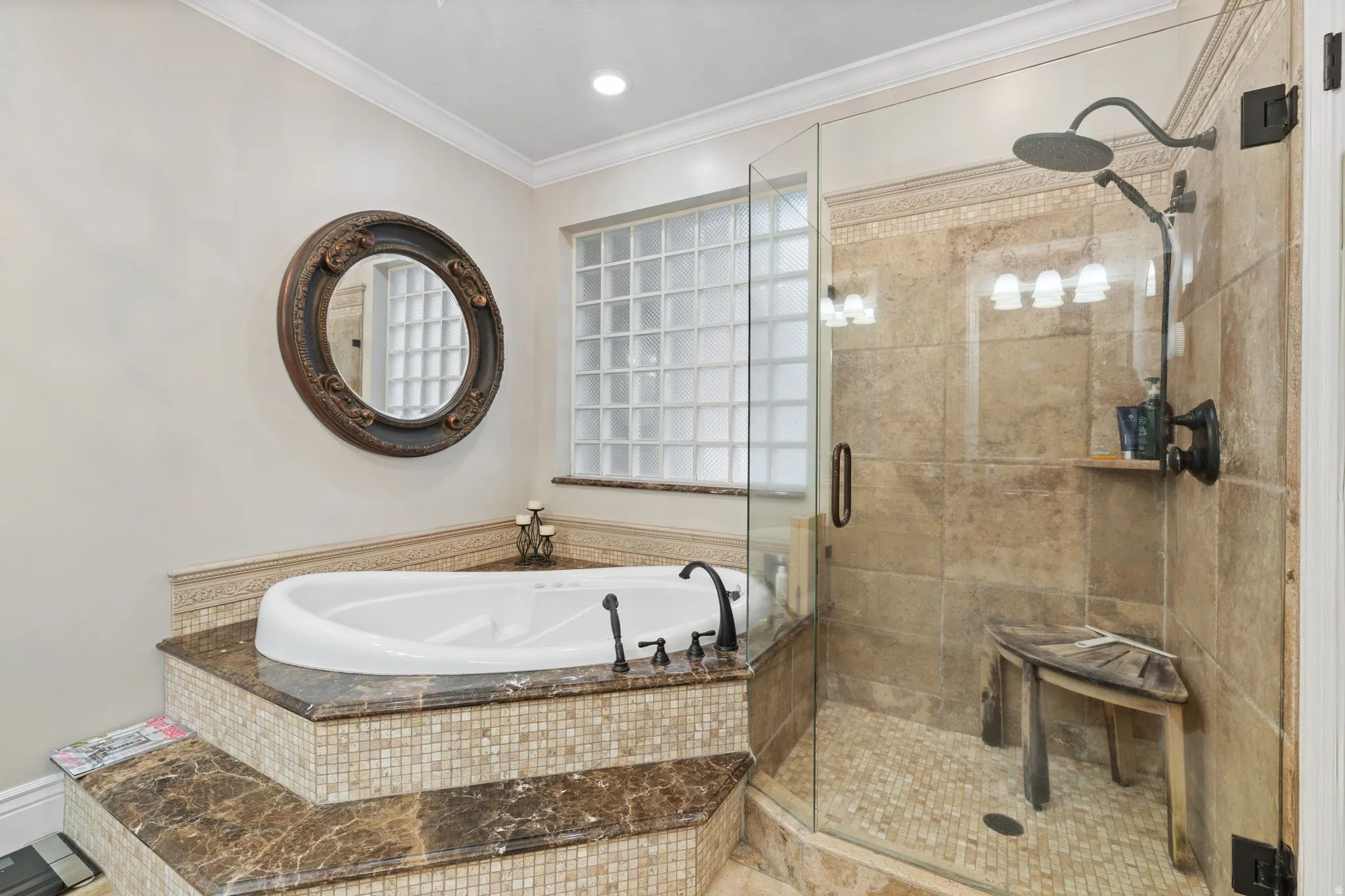 Full bathroom featuring a bath, a shower stall, and ornamental molding