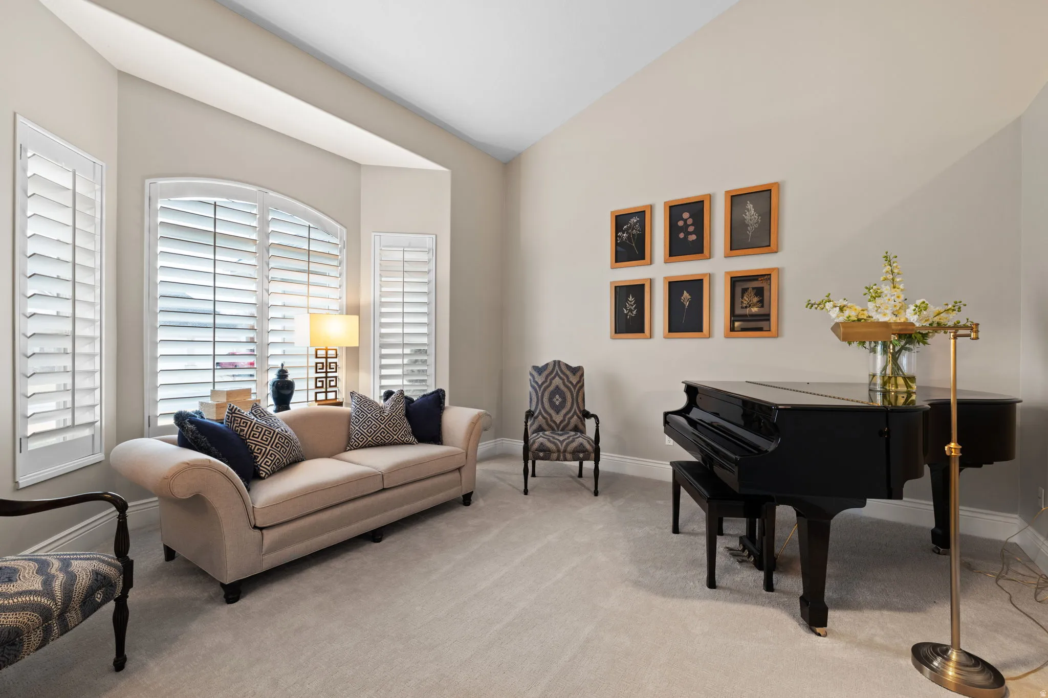 Living area featuring lofted ceiling and light colored carpet