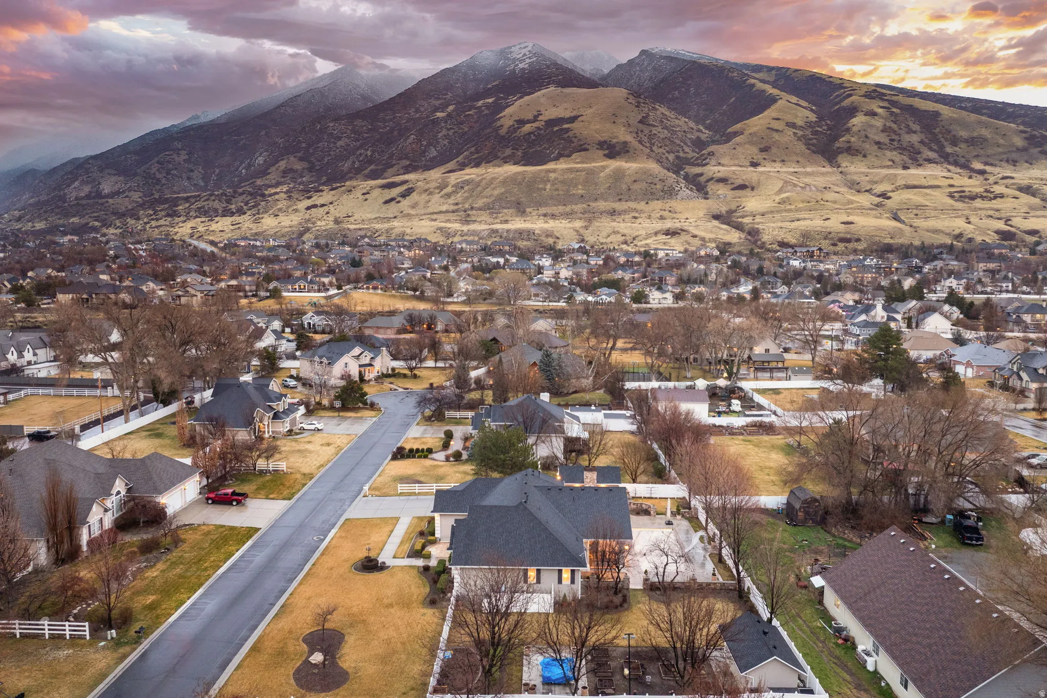 Aerial view at dusk of a residential view and a mountain view