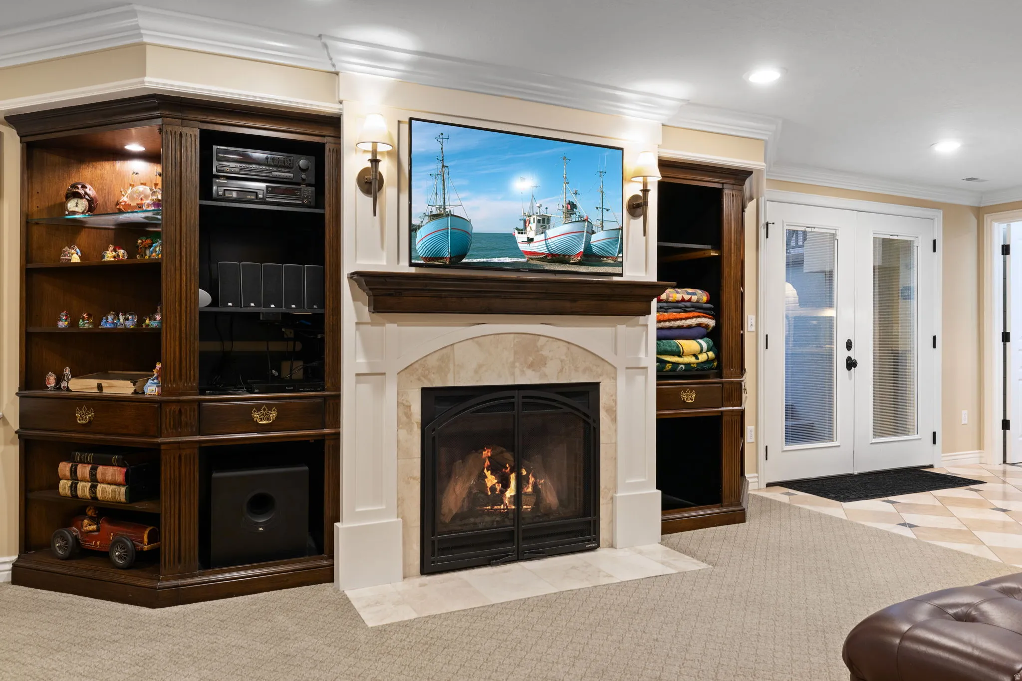 Living room featuring french doors, ornamental molding, carpet flooring, a fireplace with flush hearth, and recessed lighting