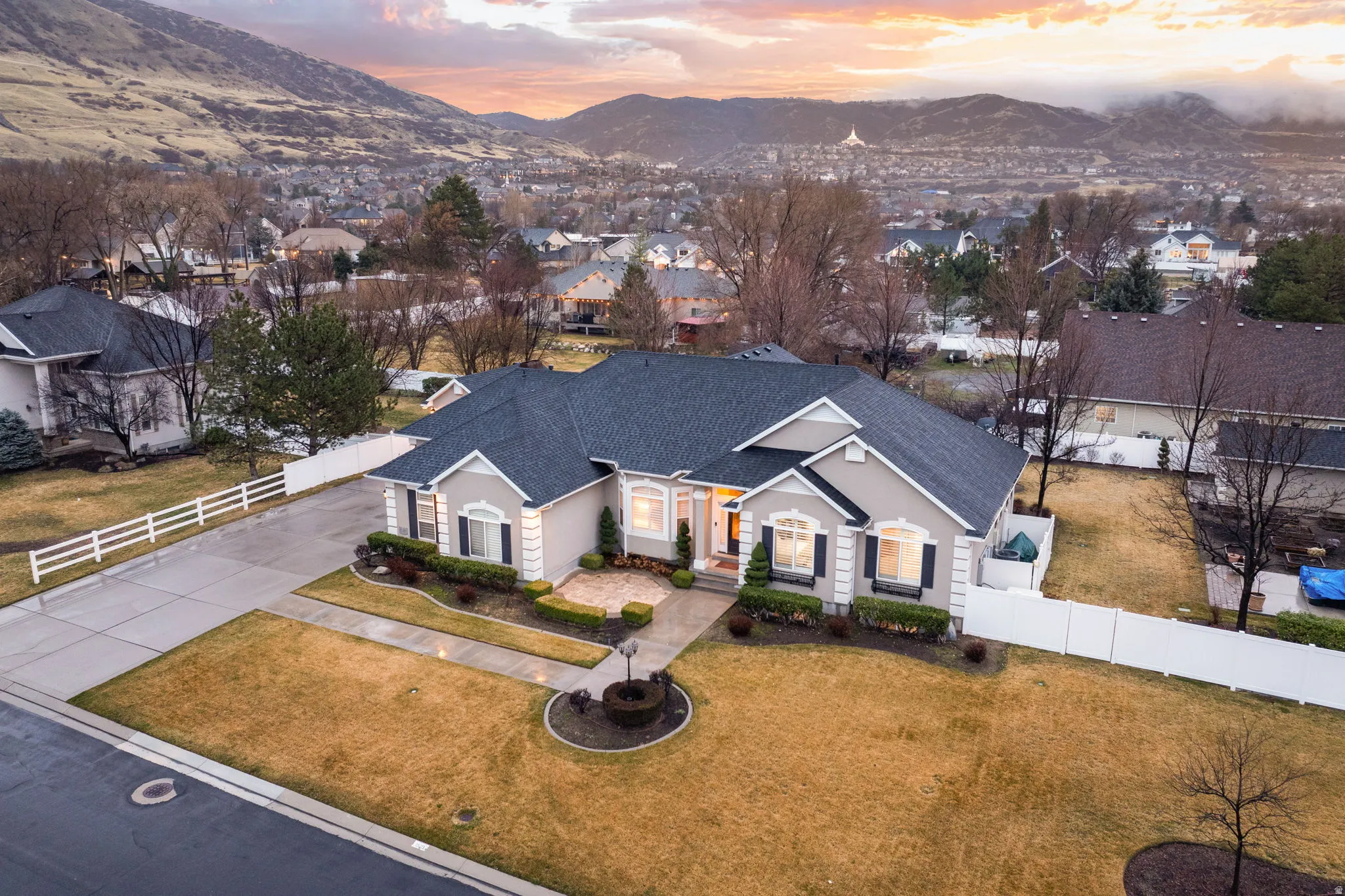 Aerial perspective of suburban area with a mountain backdrop