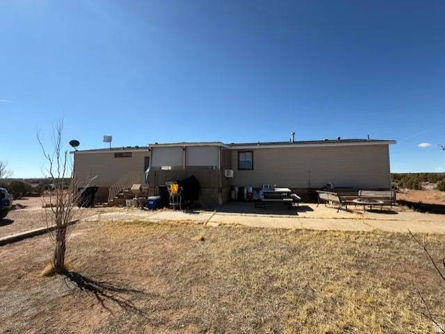 Rear view of property with a patio