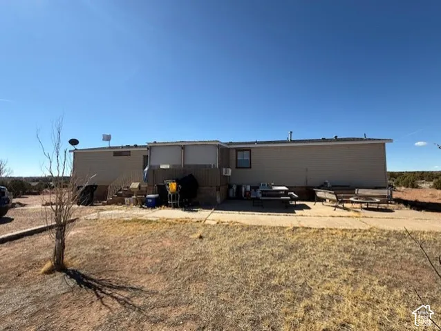 Rear view of property with a patio