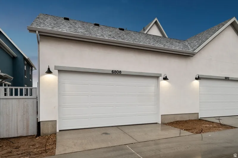 Garage with concrete driveway