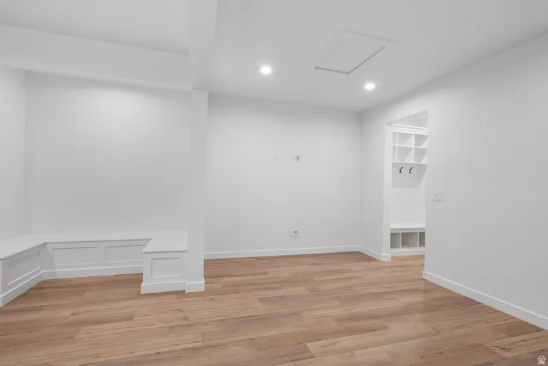 Unfurnished room with light wood-style flooring and recessed lighting