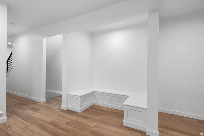 Mudroom featuring light wood-style floors and baseboards