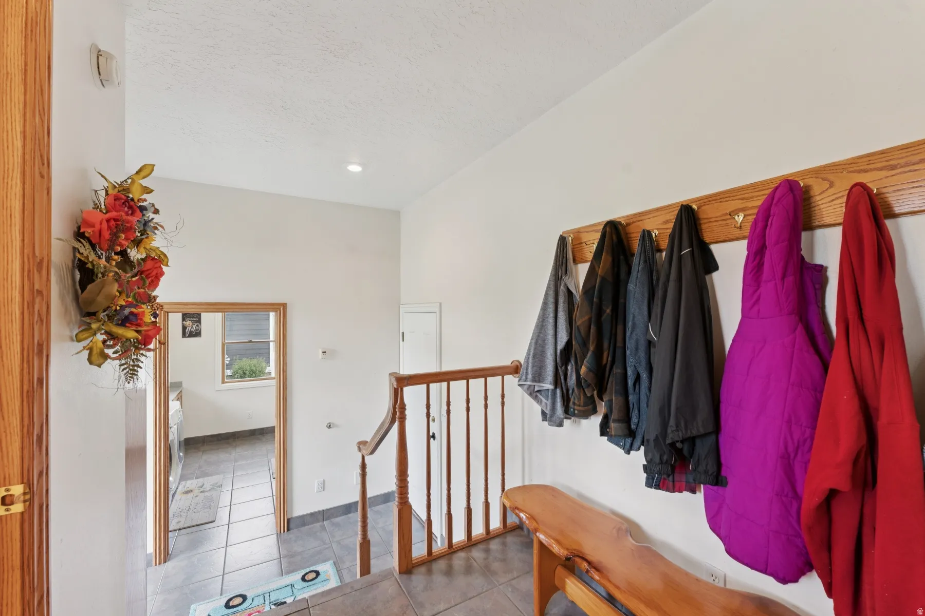 Mudroom with light tile patterned flooring and recessed lighting