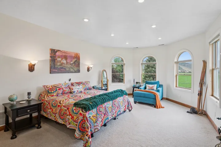 Bedroom featuring light colored carpet and recessed lighting