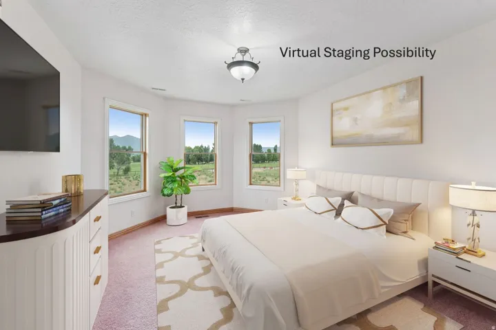 Bedroom featuring light colored carpet and a textured ceiling