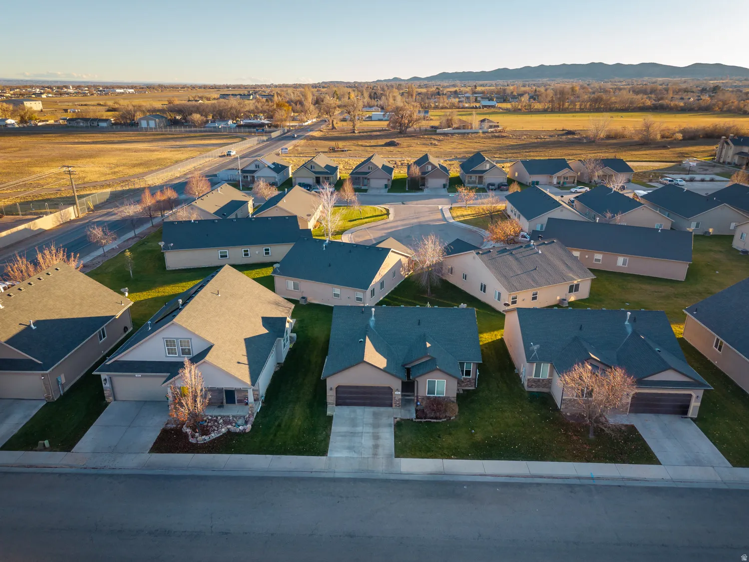 Aerial view of residential area with a mountainous background