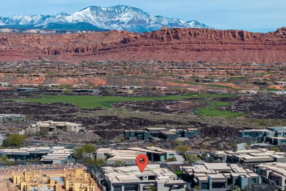 View of mountain background featuring a local golf course