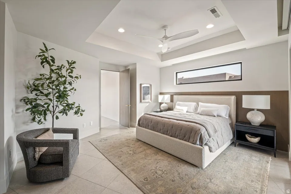 Bedroom featuring light tile patterned floors, a ceiling fan, and recessed lighting